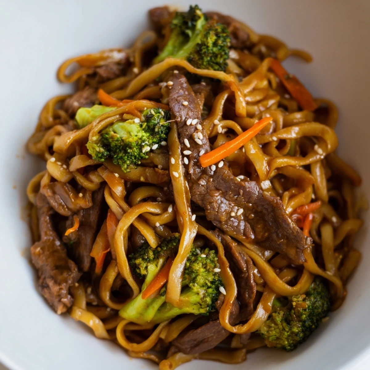 Steaming Beef and Broccoli Noodles with Soy, stir-fried with crisp broccoli florets, sliced flank steak, and a glossy, savory sauce in a hot wok.