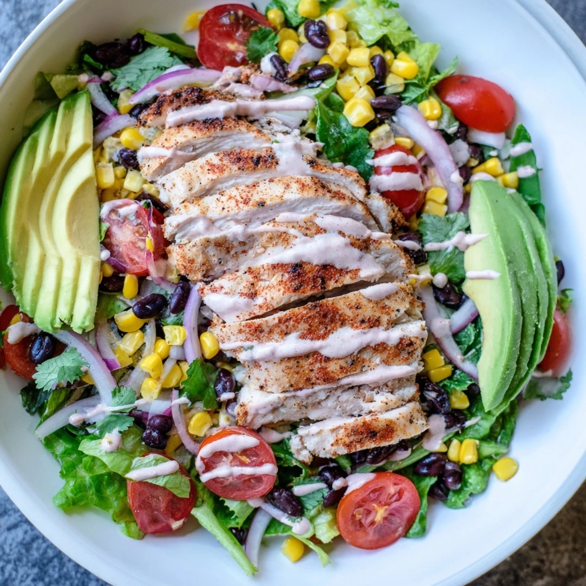Black beans and sweet corn add color and texture to the hearty Southwest Chicken Salad, ready to be served for lunch.