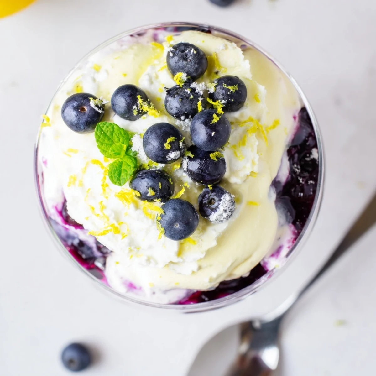 Chilled Lemon Blueberry Mousse features a creamy texture and vibrant colors, perfect for a light summer dessert serving.