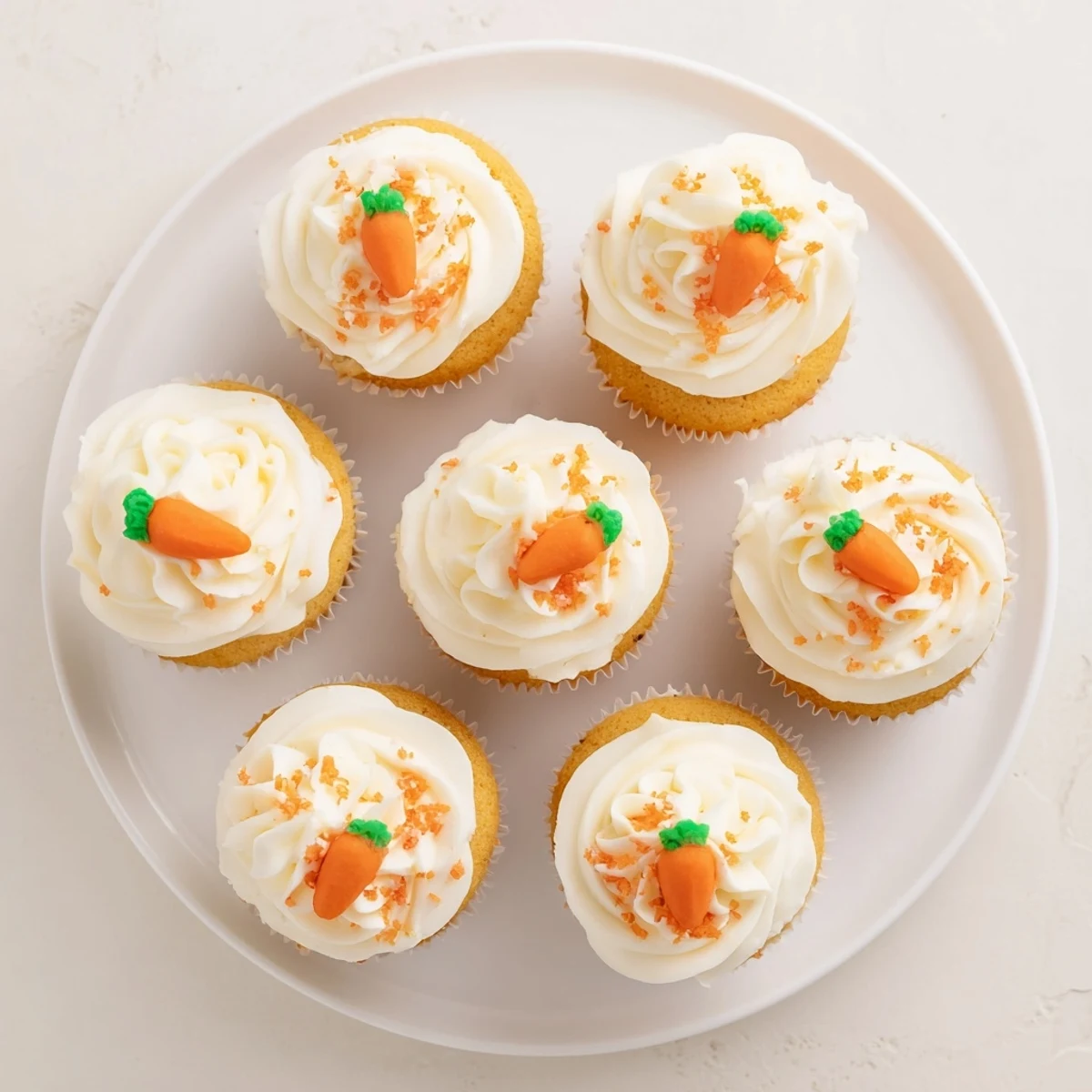 Colorful spread of simple Easter desserts featuring carrot cake cupcakes bunny cookies and chocolate nests
