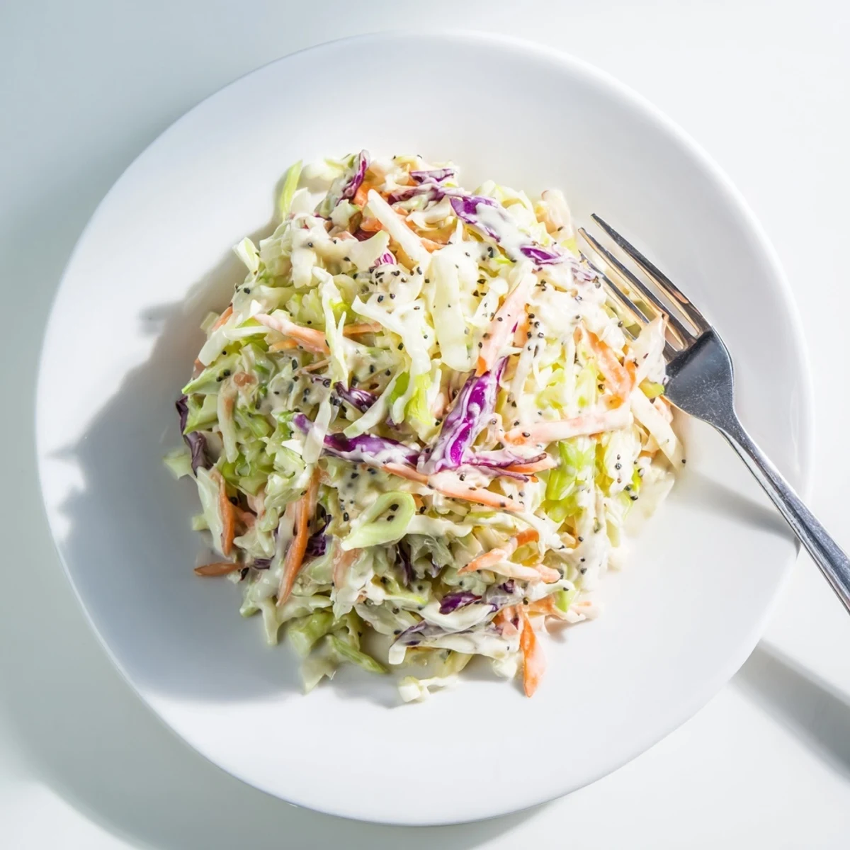 Crisp green and red cabbage tossed in creamy tangy dressing for easy coleslaw