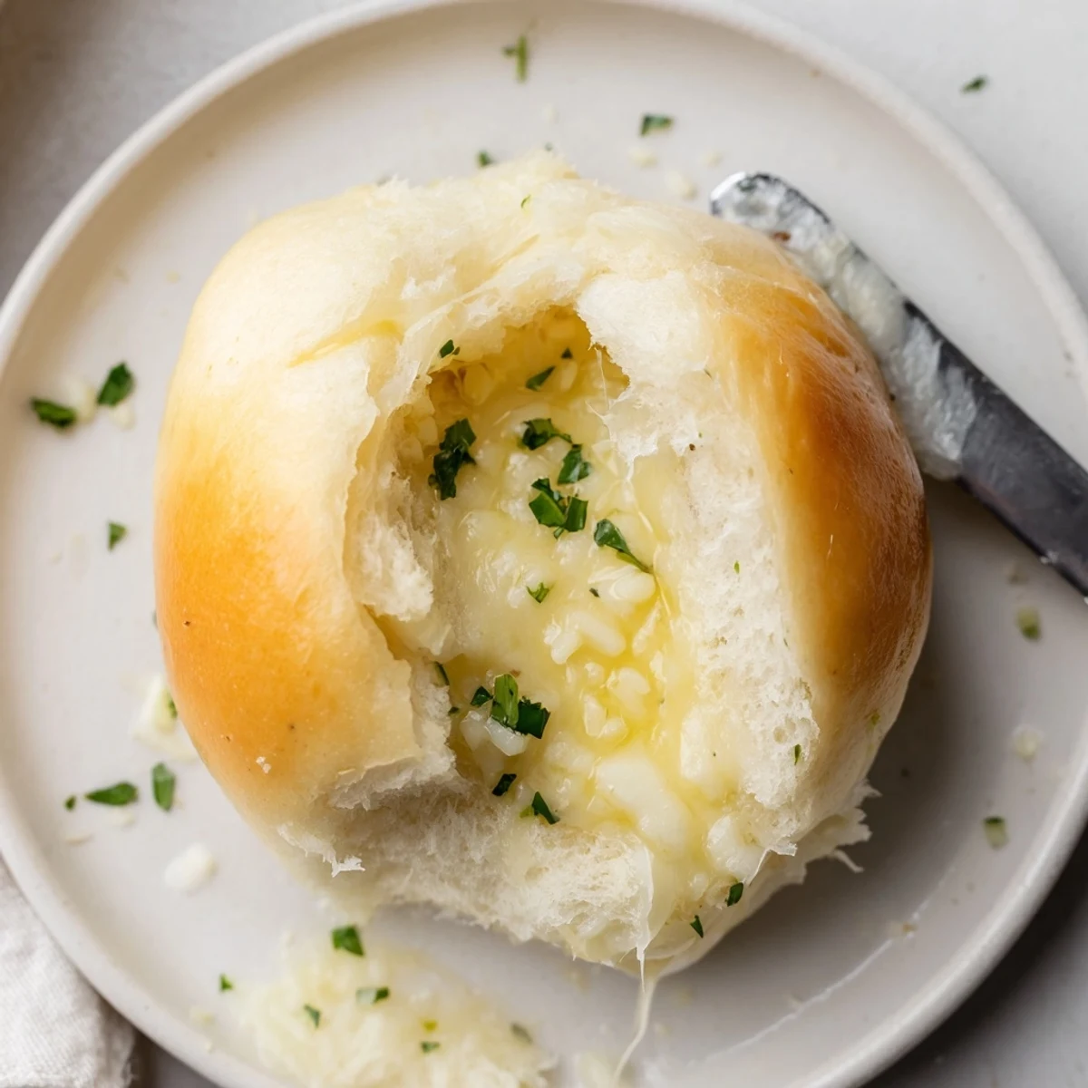 Warm Buttery Cheese Garlic Rolls on a wooden board, perfect for dipping