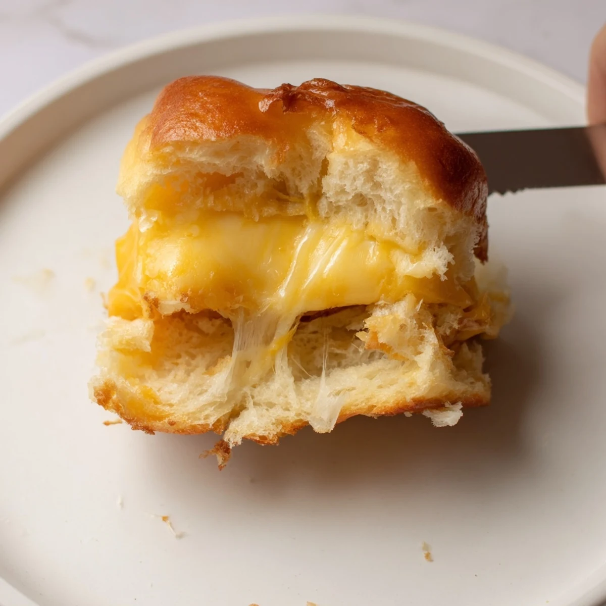 Warm Mini Grilled Cheese Hawaiian Rolls Recipe served with steaming tomato soup