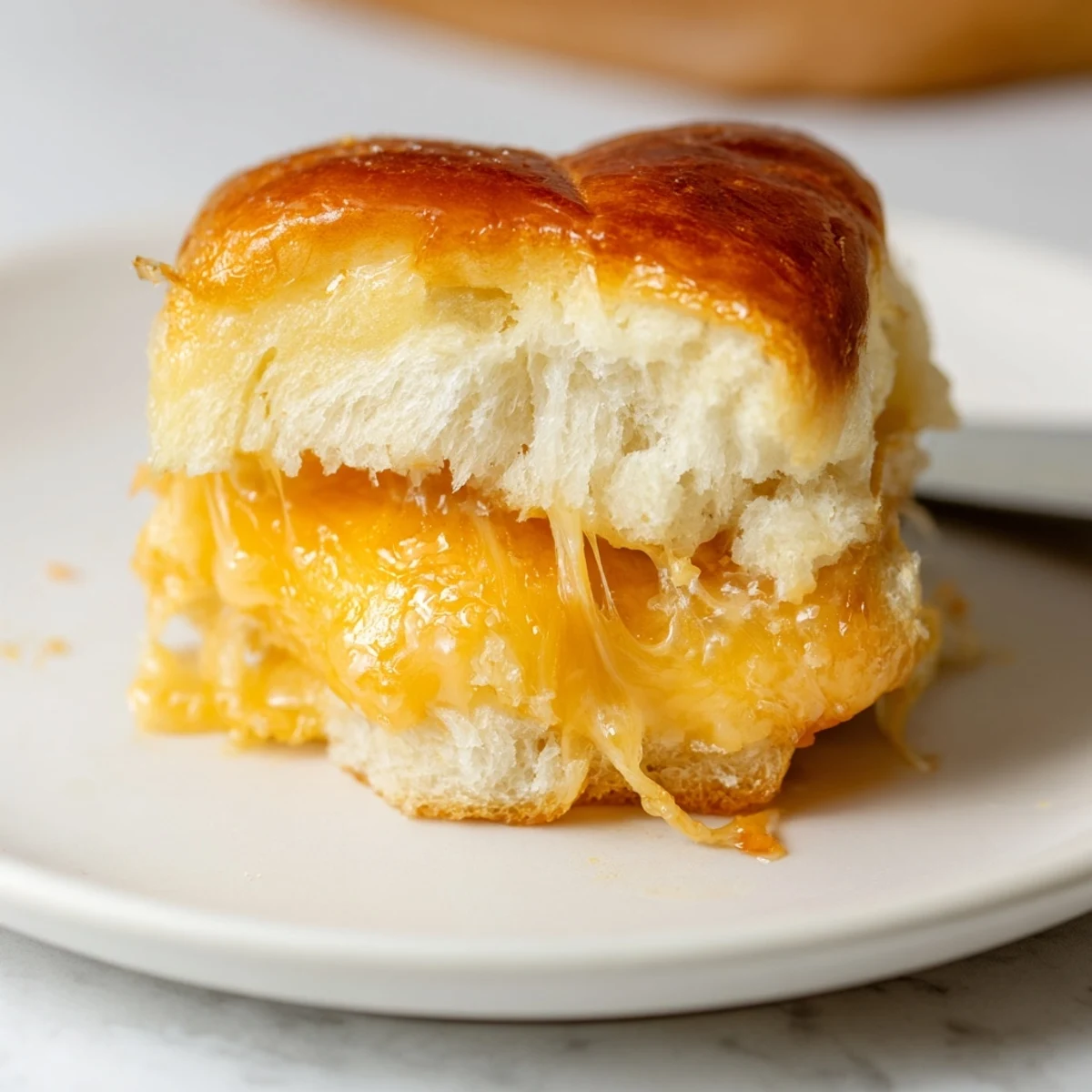 Party ready Mini Grilled Cheese Hawaiian Rolls Recipe with sweet rolls and bubbly cheese