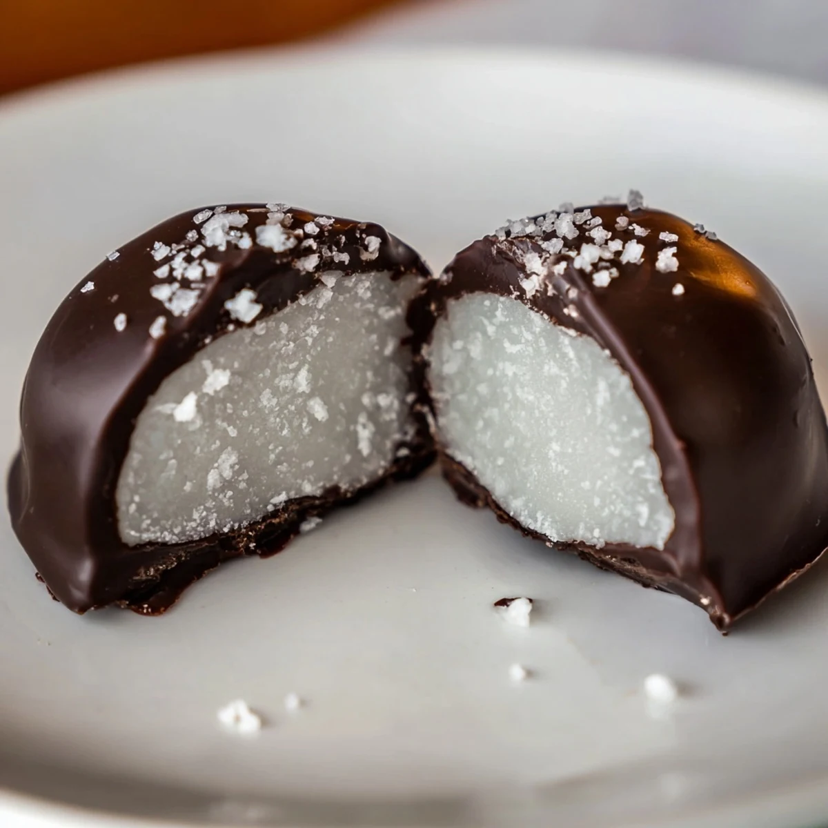 Peppermint Patties with glossy dark chocolate, cool mint center on parchment