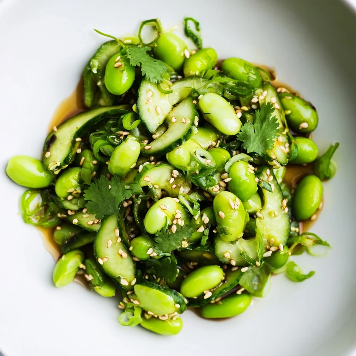 Vibrant green cucumber and edamame salad tossed with light sesame soy dressing