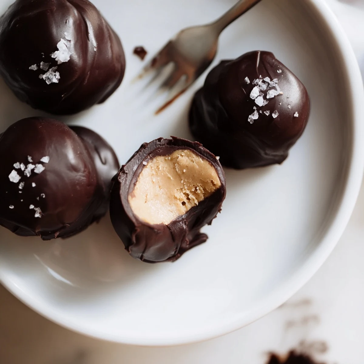 Glossy Frozen Peanut Butter Greek Yogurt Bites Dipped In Dark Chocolate With Sea Salt