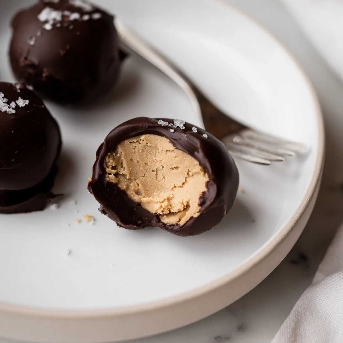 Frozen Peanut Butter Greek Yogurt Bites Dipped In Dark Chocolate With Sea Salt, chilled